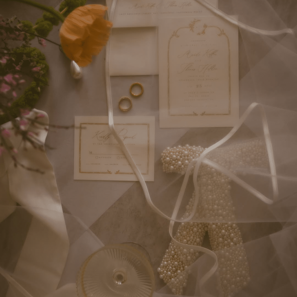 Wedding invitation suite and orange florals.