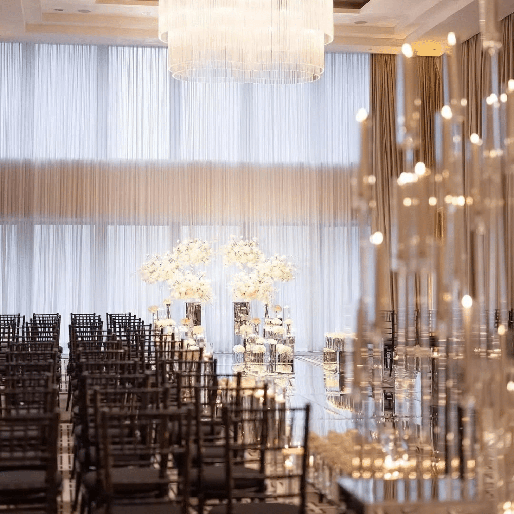 Wedding ceremony featuring black chiavari chairs