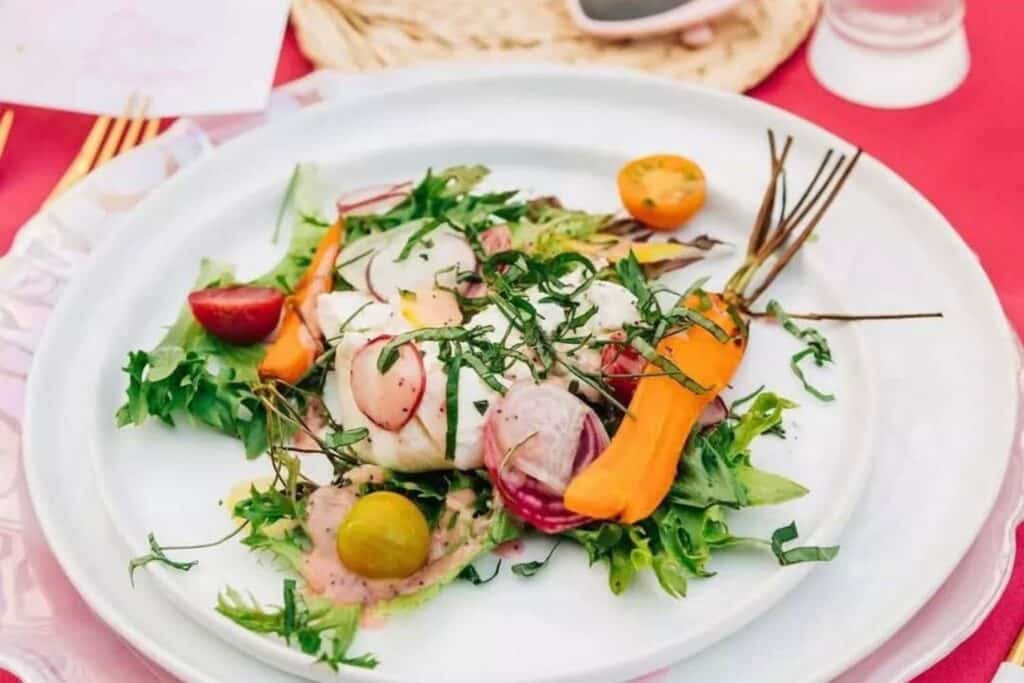 summer event hosting using white ceramic serving ware event rentals